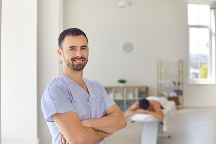 Smiling provider in a treatment room